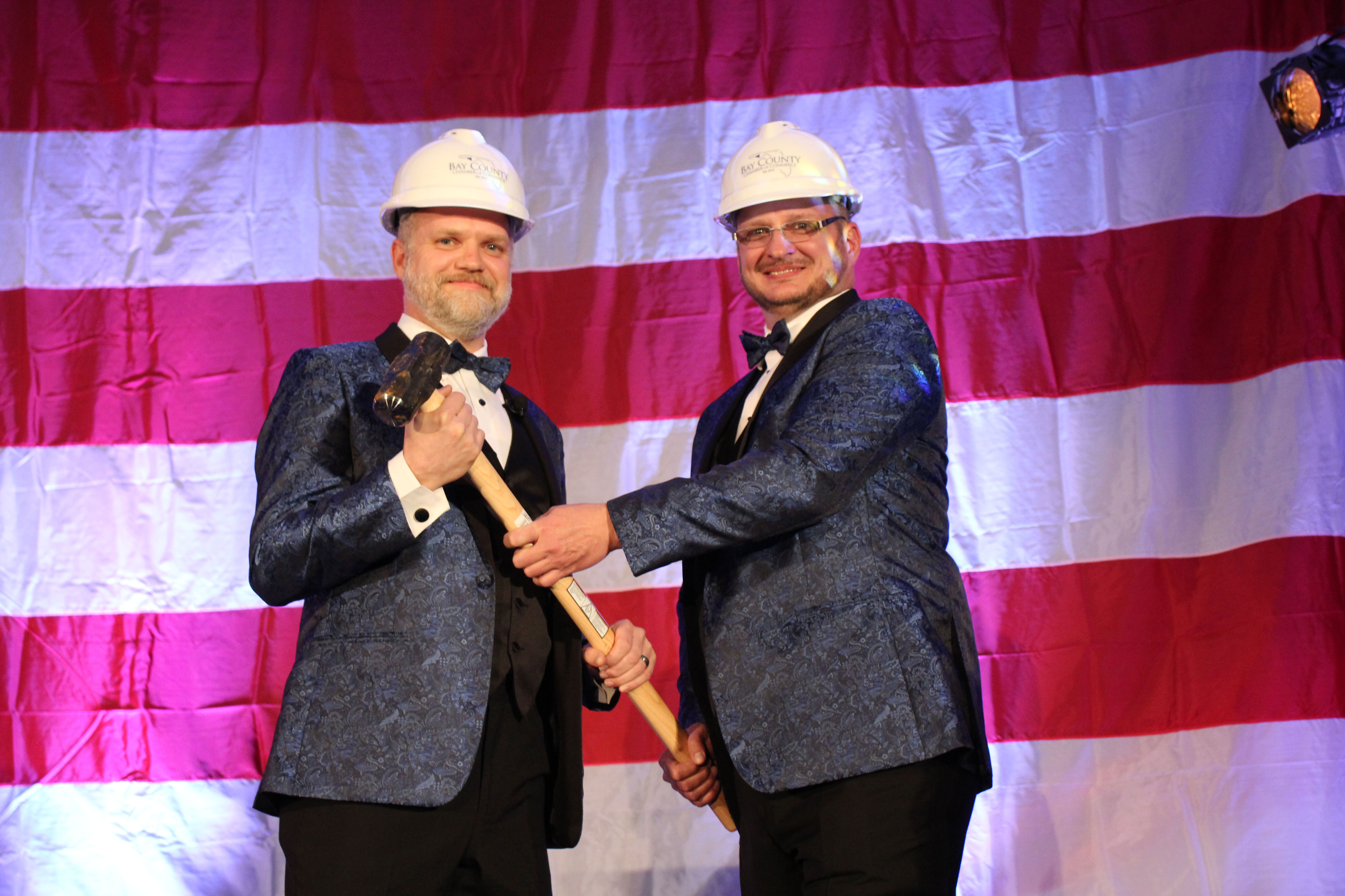 2018 Chair of the Board, Will Cramer, "passes the gavel" to incoming 2019 Chair of the Board, Doug Moore, at the 2019 Annual Dinner and Awards Ceremony.