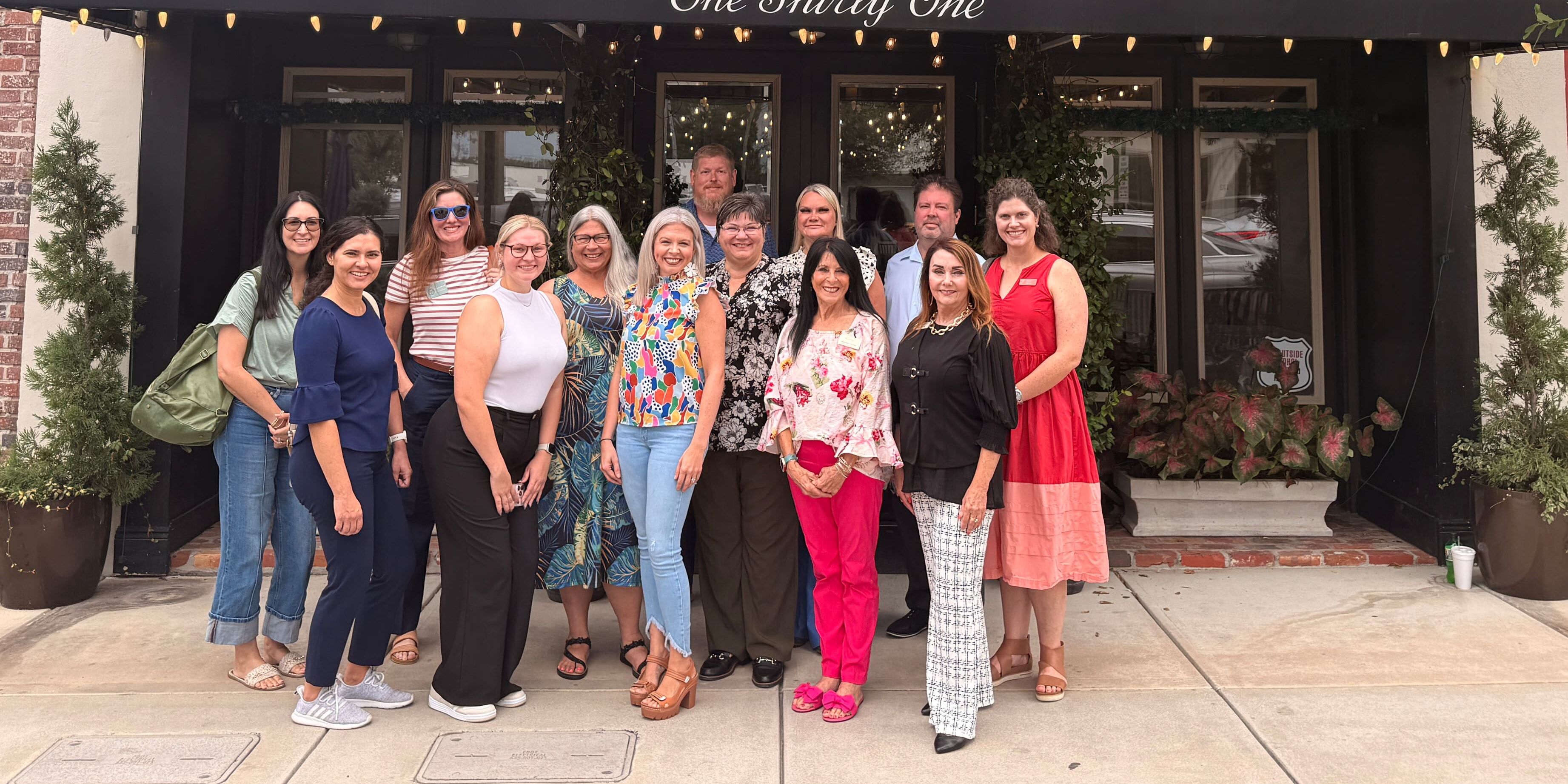 Bay Chamber Connect Group participants gather for a group photo outside One Thirty One by Trigo in downtown Panama City, Florida.