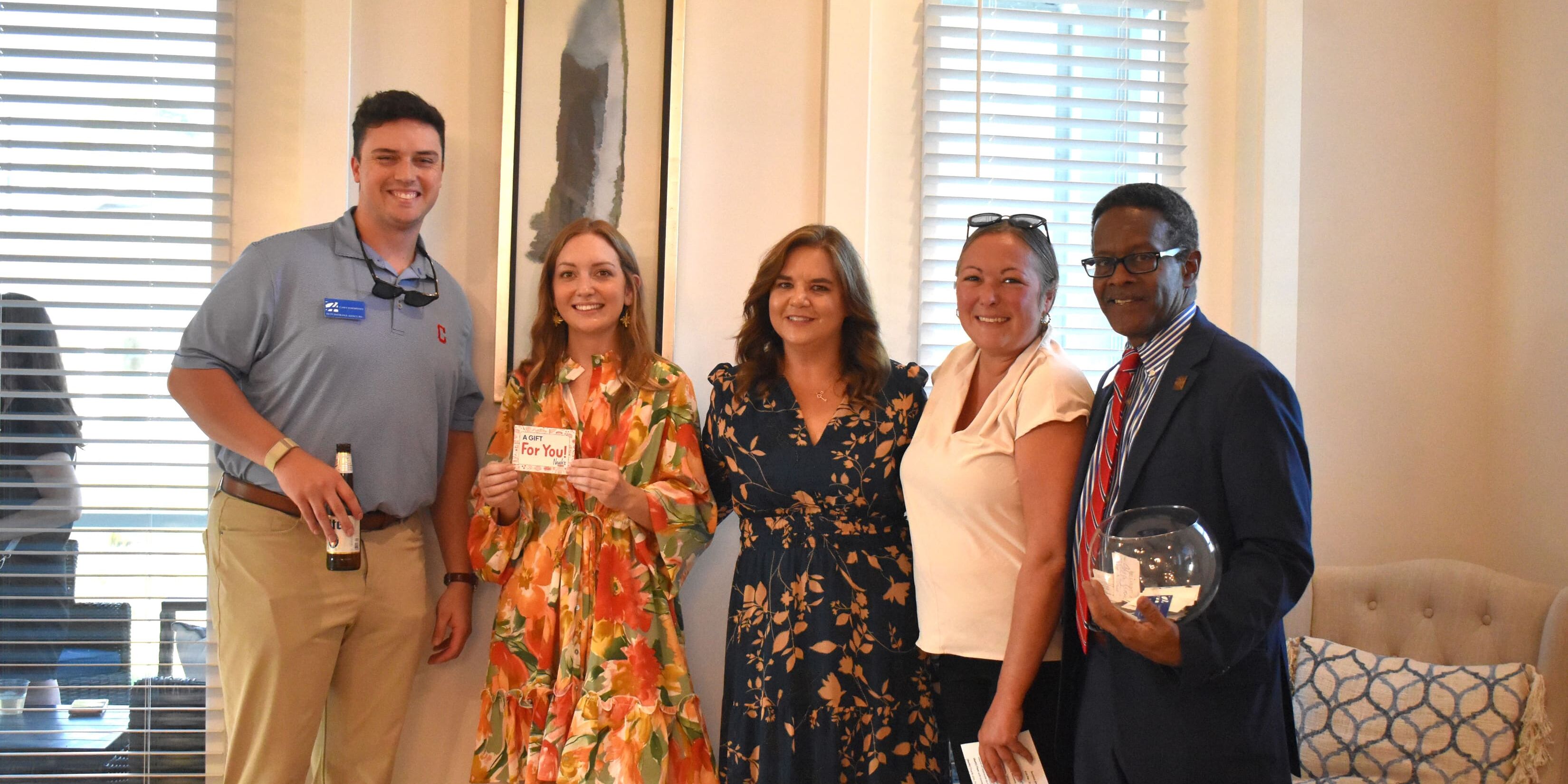 Bay County Chamber of Commerce members and guests gather outdoors for a Business After Hours networking event in Bay County, Florida.